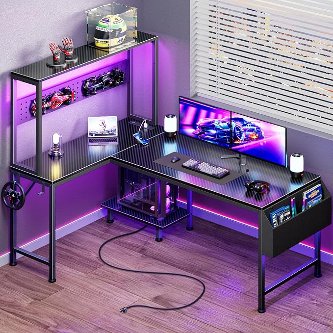 PRAISUN L Shaped Gaming Desk with LED Lights & Power Outlets, Reversible Computer Desk with Storage Shelves & Bag, Large Corner Home Office Desk with Pegboard for Work from Home, Carbon Fiber Black by PRAISUN